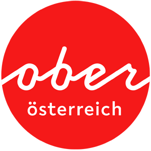 Logo Oberösterreich Tourismus: Roter Kreis mit weißem Oberösterreich-Schriftzug